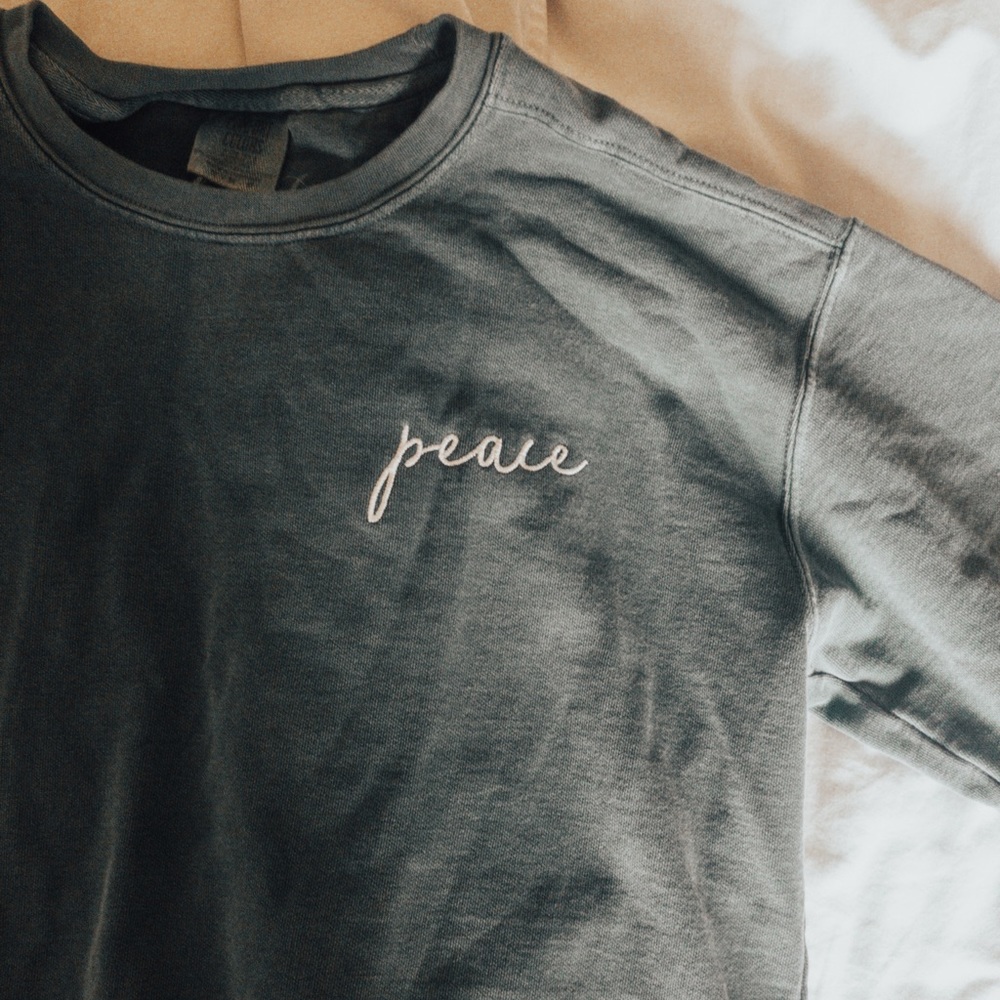 light blonde green “peace” sweatshirt
